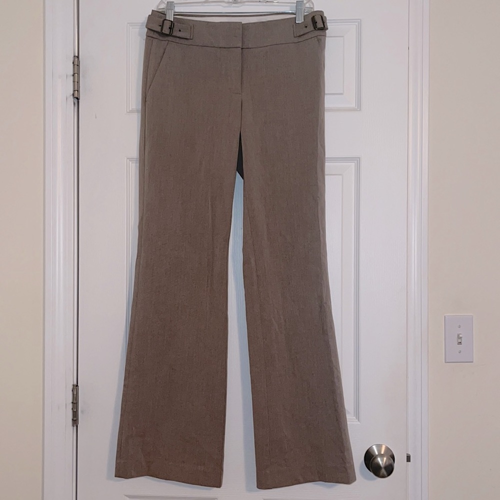 Light tan/neutral pants 2 clasp closure. Excellent condition.  Buckle accents